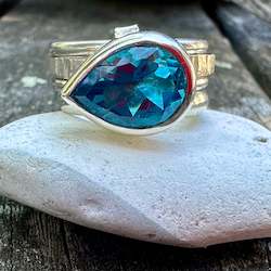 Rings: Swiss blue topaz Unity ring