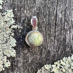 New Zealand Pounamu Greenstone: 8mm Marsden Flower greenstone and sterling silver pendant