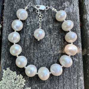 Pearls: Large white freshwater pearl and sterling silver bracelet